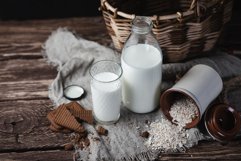 Oatmeal vegetarian milk on a wooden table Product Image 1