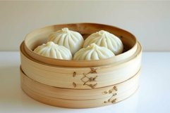 Steamed pork buns sitting in a bamboo steamer Product Image 1