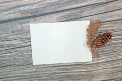 A5 paper mockup with dry leaves on wooden background Product Image 3