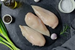 Raw chicken breast fillet with spice and greens dark photo. Product Image 1