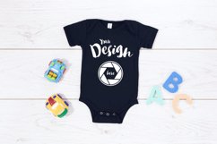 Black Bella Canvas 100B MockUp One Piece Flat Lay Bodysu Product Image 1