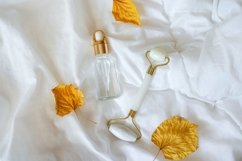 Glass bottle with oil, Gua sha stone for face massage Product Image 1