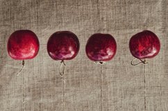 Autumn red apples hung on a linen cloth background Product Image 1