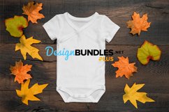 Baby bodysuit white mock up with autumn leaves decoration