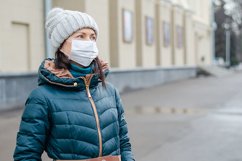 woman wears medical mask in the empty street. Product Image 1