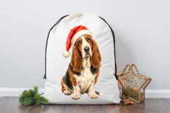 Christmas Basset Hound PNG with detailed watercolor fur, long drooping ears, a red Santa cap, and a sweet expressive face for festive creative projects.