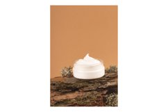 Cream for the face on the bark of a tree. Natural care Product Image 1