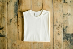 White T-shirt on a wooden background Product Image 1