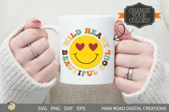 retro smiley face cut file being used on a coffee mug held by a girl