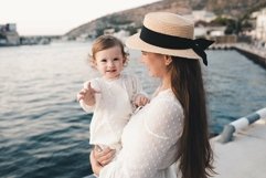 Photo of happy mother with baby daughter over sea Product Image 1