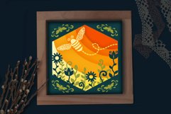 bee light box on table with lace and decorative plants