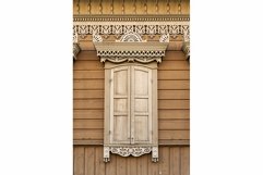 Facade of a wooden building with a window. Product Image 1