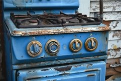 Vintage blue gas stove in disrepair Product Image 1