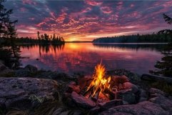 Campfire burning near lake with beautiful sunset reflecting Product Image 1