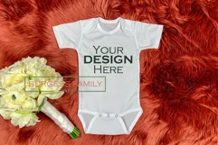 Baby bodysuit on red fur | Craft mockup Product Image 1