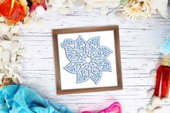 blue layered mandala in frame