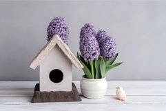 Wooden bird house on the table with potted hyacinth flower. Product Image 1