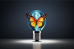 Colorful butterfly sitting on light bulb on dark background. Product Image 1
