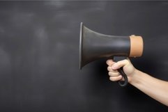 Hand holding megaphone. Generate Ai Product Image 1