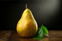 Golden pear with leaves on wooden surface Product Image 1