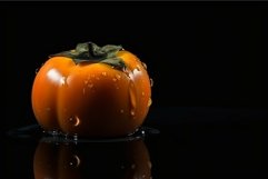 Persimmon on black background Product Image 1