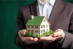 Real estate agent holding house model. Generate Ai Product Image 1