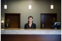 Smiling receptionist desk lobby. Generate Ai Product Image 1