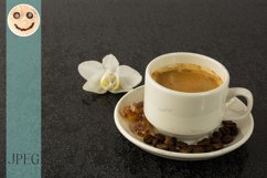 Coffee cup and white orchid Product Image 1