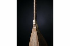 Part ancient Asian stringed musical instrument on black Product Image 1