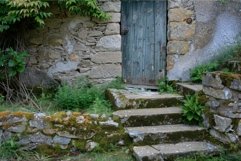 Ancient stone cottage entrance with mosscovered steps Product Image 1