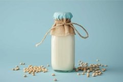 Bottle of soy milk with soybeans on blue background Product Image 1