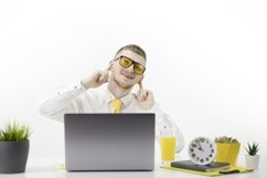 Glad caucasian male office worker makes movements to music. Product Image 1