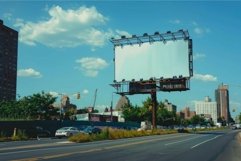 Large blank billboard displaying nothing on city street Product Image 1