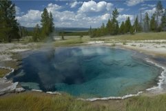 Serene thermal spring in forested landscape Product Image 1