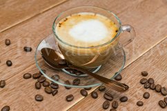 hot coffe cup with milk on a wooden background. Product Image 1