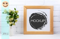 Square wooden picture frame mockup with white spirea Product Image 1
