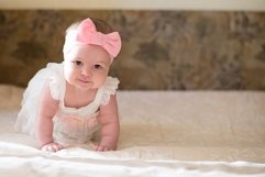 Portrait of pretty baby girl on bed , Family, childhood Product Image 1
