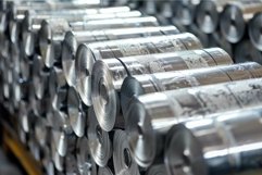 Rolls of sheet metal stacked in warehouse of metalworking fa Product Image 1