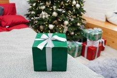 Christmas, New Year green gift box on the bed Product Image 1