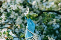 Women&#039;s hands in medical gloves and a pearl bracelet. Product Image 1