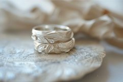Elegant wedding bands on delicate lace Product Image 1