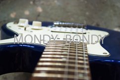 Blue-white electric guitar close-up. The strings. Product Image 1