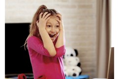Emotional portrait of schoolgirl studying homework Product Image 1