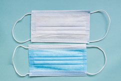 Two sides of medical mask on blue background Product Image 1