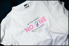 a t-shirt with a print saying in this family no one fights alone