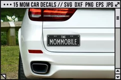 a car with a funny decal saying 'the mommobile'