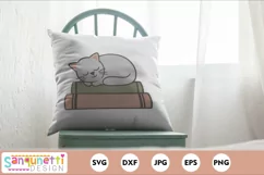 cat and books svg on a pillow