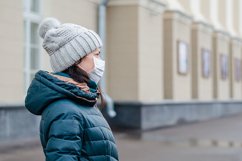 woman wears medical mask in the empty street. Product Image 1