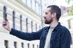 Bearded blogger with smartphone Product Image 1