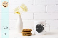 White coffee mug mockup with soft yellow orchid in vase Product Image 1